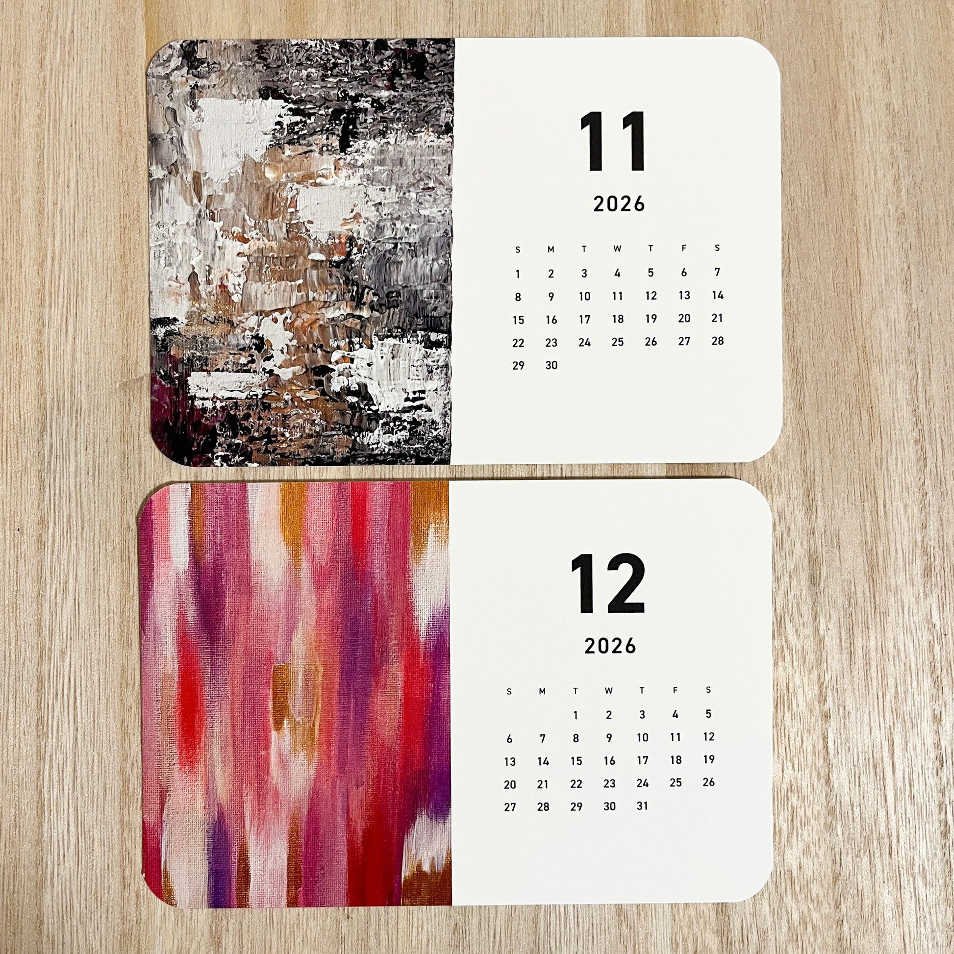 Detailed view of Yuka Mitsufuji 2026 calendar pages, two months displayed with vibrant abstract artworks / Yuka Mitsufuji 2026年カレンダー、2ヶ月分ページの詳細、鮮やかな抽象画作品